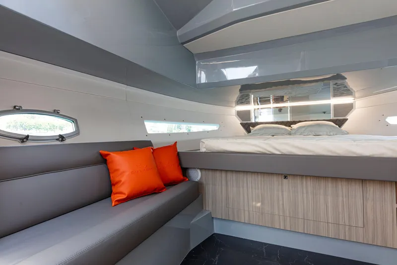 Slide: The Image of Luxurious interior of 2024 Rio Yachts Daytona 35 with modern design and vibrant orange accents. - 32