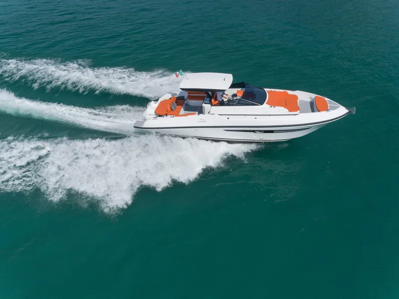 Slide: The Image of 2024 Rio Yachts Daytona 35 cruising on open water, showcasing sleek design and vibrant seating. - 4