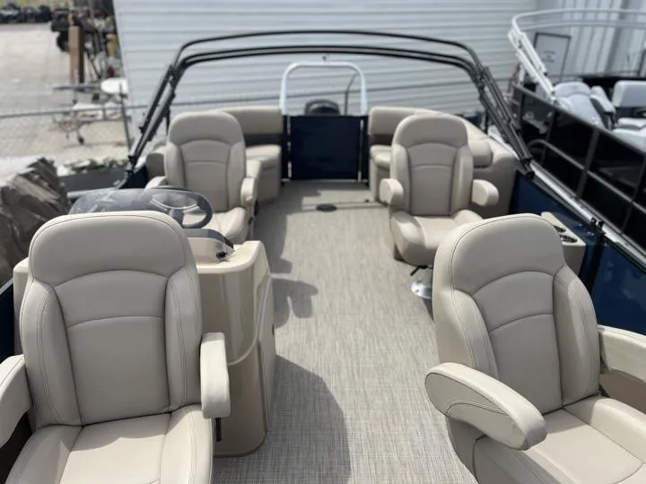 Slide: The Image of 2024 Bentley Pontoons Fish 203 Center Walk-Thru 3/4 Tube interior with beige seating. - 11
