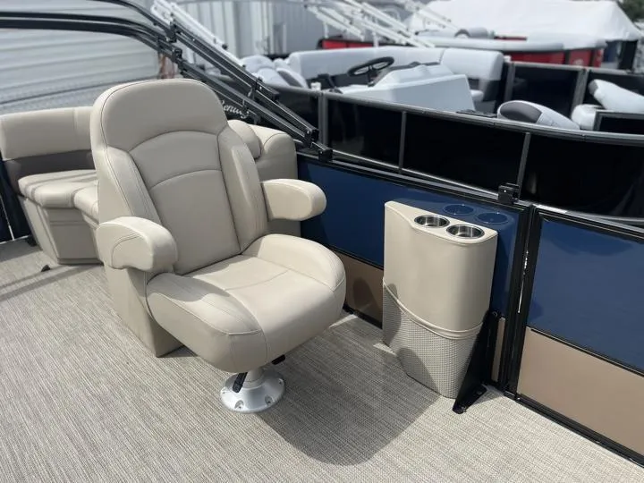 Slide: The Image of 2024 Bentley Pontoons Fish 203 Center Walk-Thru 3/4 Tube interior with beige captain's chair. - 12