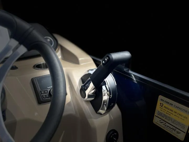 Slide: The Image of 2024 Bentley Pontoons Fish 203 Center Walk-Thru 3/4 Tube control panel and throttle. - 21