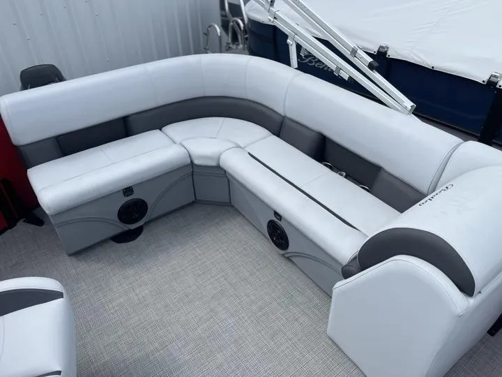 Slide: The Image of 2024 Bentley Pontoons LE 160 CR interior seating with white and gray upholstery. - 11