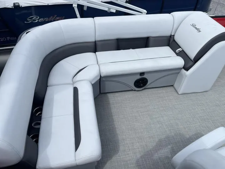 Slide: The Image of 2024 Bentley Pontoons LE 160 CR interior seating with gray and white upholstery. - 13