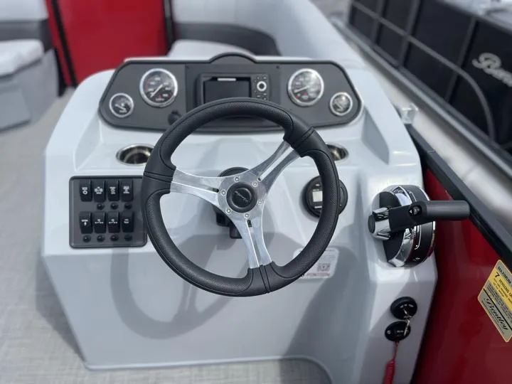 Slide: The Image of 2024 Bentley Pontoons LE 160 CR steering console with gauges and controls. - 15