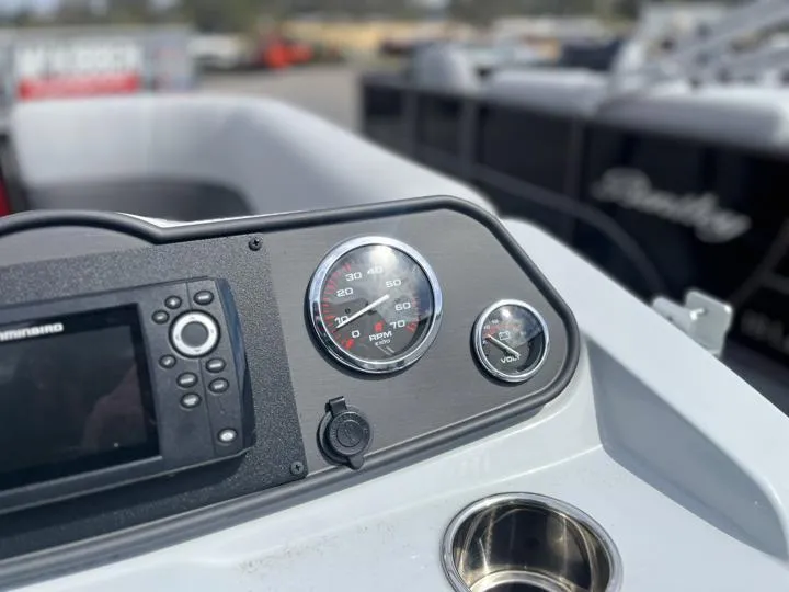 Slide: The Image of Close-up of 2024 Bentley Pontoons LE 160 CR dashboard with gauges and navigation system. - 19