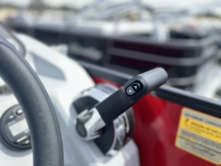 Slide: The Image of Close-up of 2024 Bentley Pontoons LE 160 CR throttle control. - 21