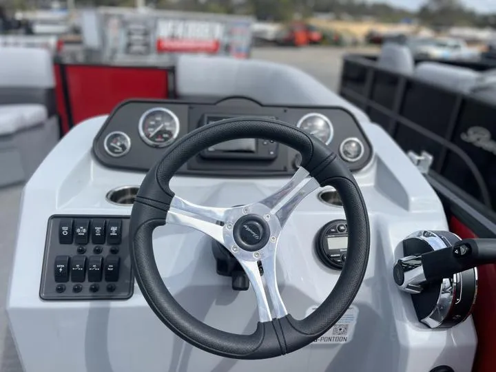 Slide: The Image of 2024 Bentley Pontoons LE 160 CR dashboard and steering wheel. - 22