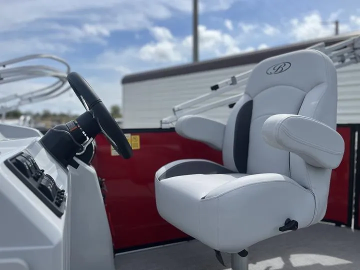 Slide: The Image of Captain's chair and steering wheel of 2024 Bentley Pontoons LE 160 CR. - 23