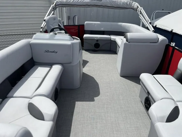 Slide: The Image of 2024 Bentley Pontoons LE 160 CR interior with spacious seating and modern design. - 8