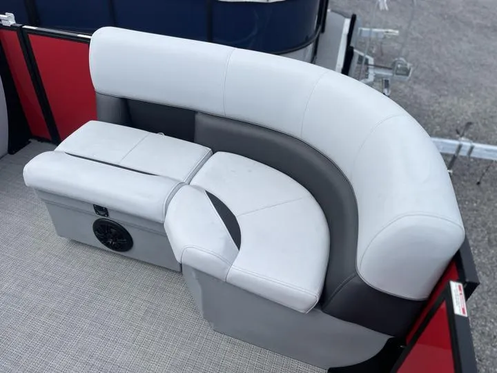 Slide: The Image of 2024 Bentley Pontoons LE 160 CR boat seating area with white and gray upholstery. - 9