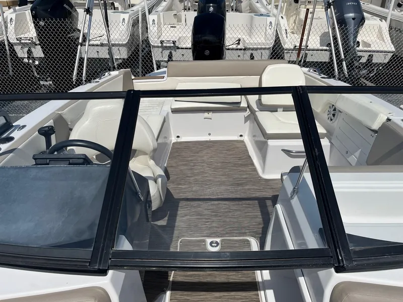 Slide: The Image of 2018 Glastron GTD boat interior with seating and steering wheel. - 5