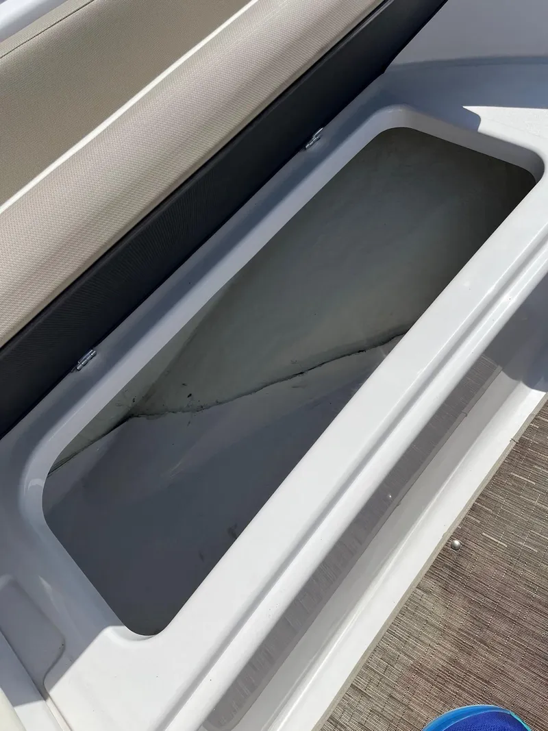 Slide: The Image of Storage compartment in a 2018 Glastron GTD boat. - 8
