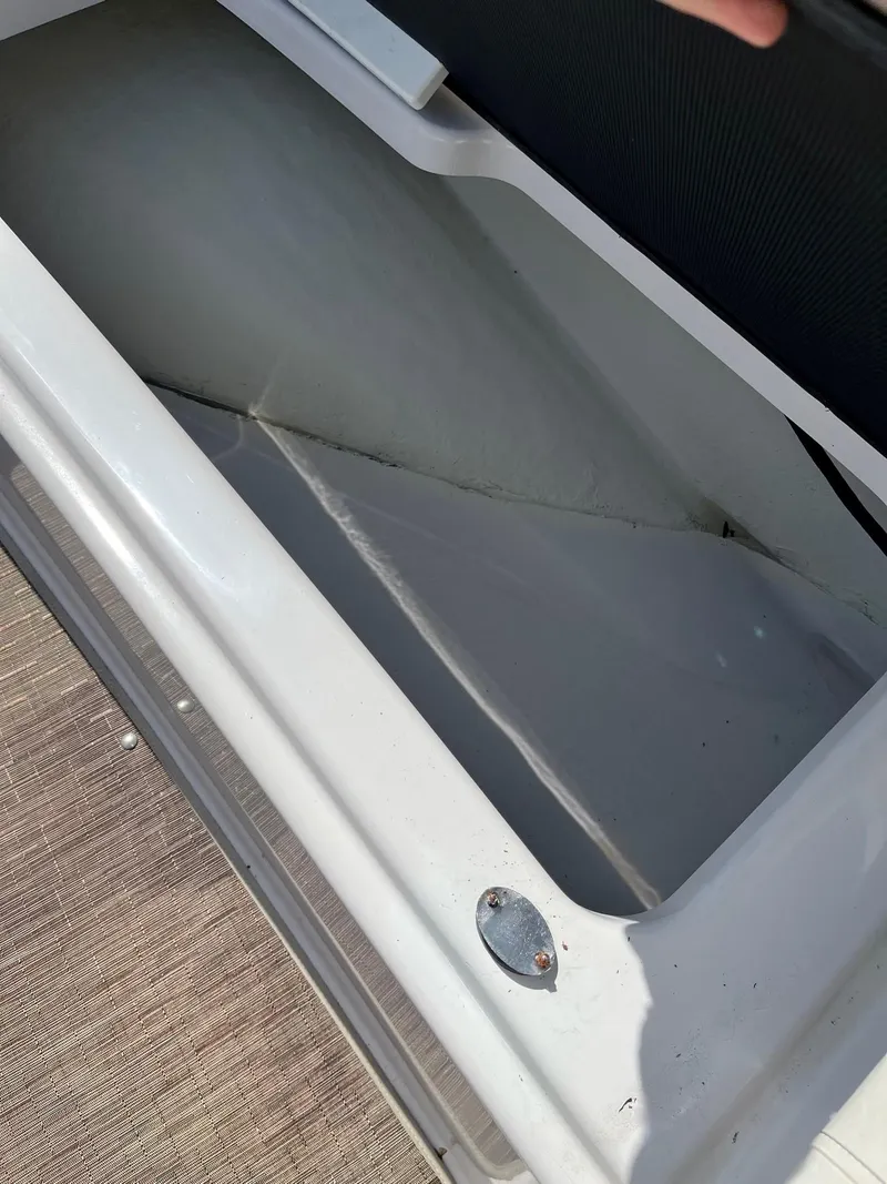 Slide: The Image of 2018 Glastron GTD boat storage compartment. - 9