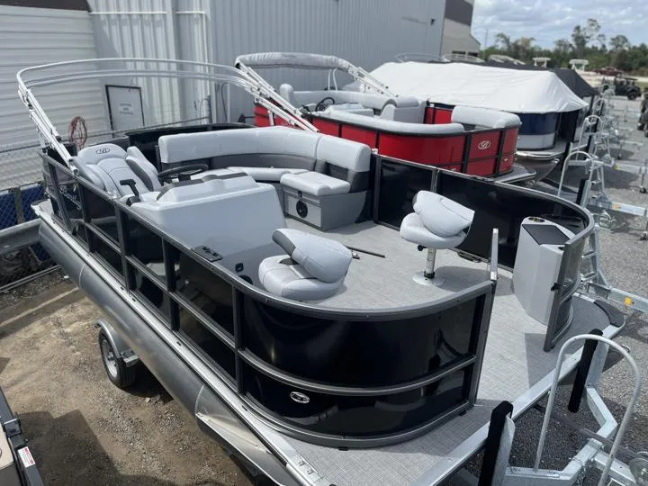 Slide: The Image of 2024 Bentley Pontoons LE 180 3 PT pontoon boat with black exterior and spacious seating. - 10