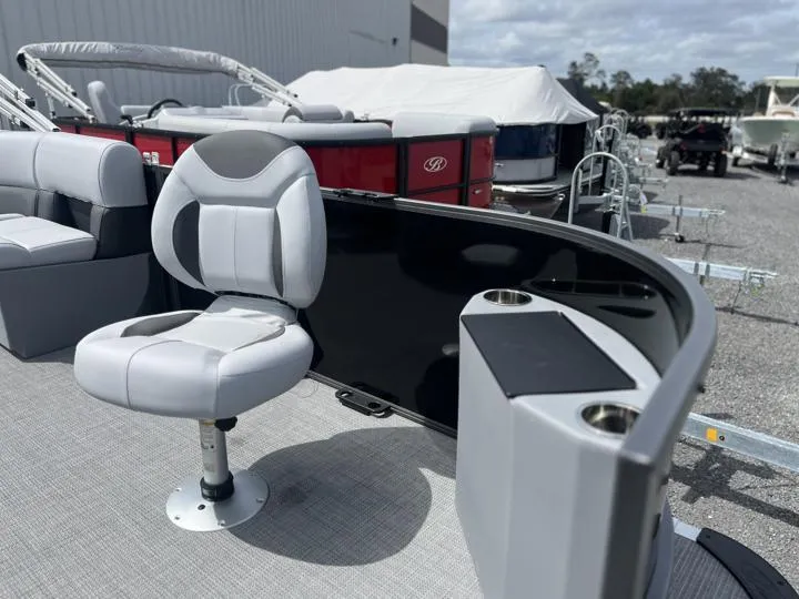 Slide: The Image of 2024 Bentley Pontoons LE 180 3 PT interior with seating and cup holders. - 13