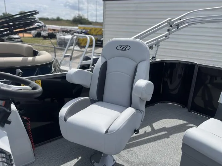 Slide: The Image of 2024 Bentley Pontoons LE 180 3 PT captain's chair and helm station. - 17