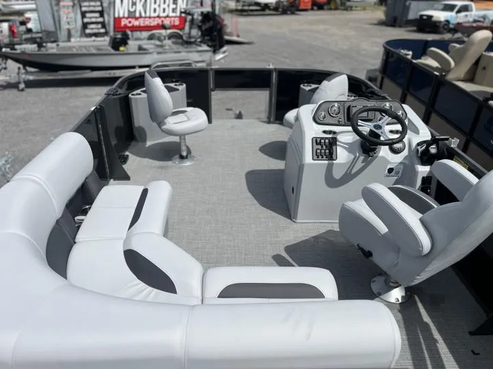 Slide: The Image of 2024 Bentley Pontoons LE 180 3 PT interior with seating and steering console. - 19