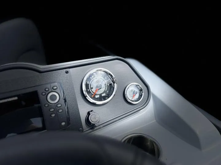 Slide: The Image of Dashboard of 2024 Bentley Pontoons LE 180 3 PT with gauges and controls. - 23