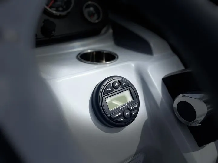 Slide: The Image of Close-up of the 2024 Bentley Pontoons LE 180 3 PT dashboard controls. - 25
