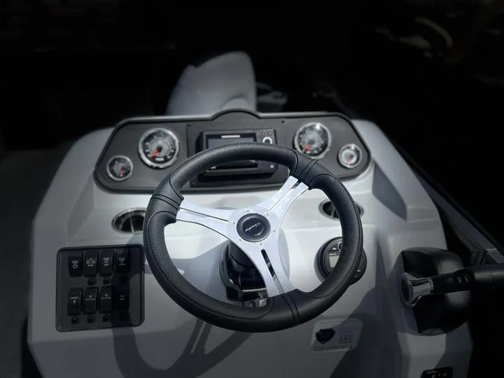 Slide: The Image of 2024 Bentley Pontoons LE 180 3 PT steering console with gauges and controls. - 27