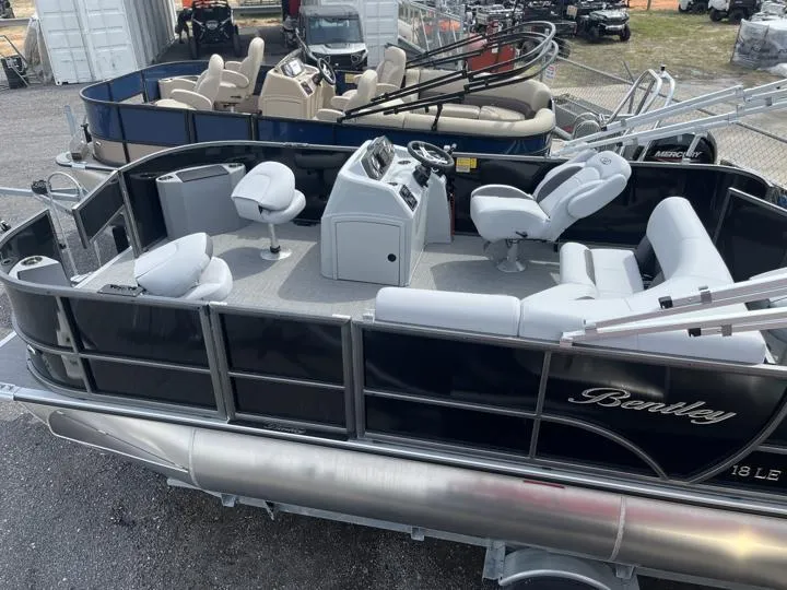 Slide: The Image of 2024 Bentley Pontoons LE 180 3 PT pontoon boat with luxurious seating and modern design. - 3