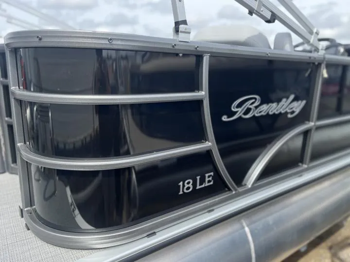 Slide: The Image of 2024 Bentley Pontoons LE 180 3 PT, black exterior, close-up view. - 6