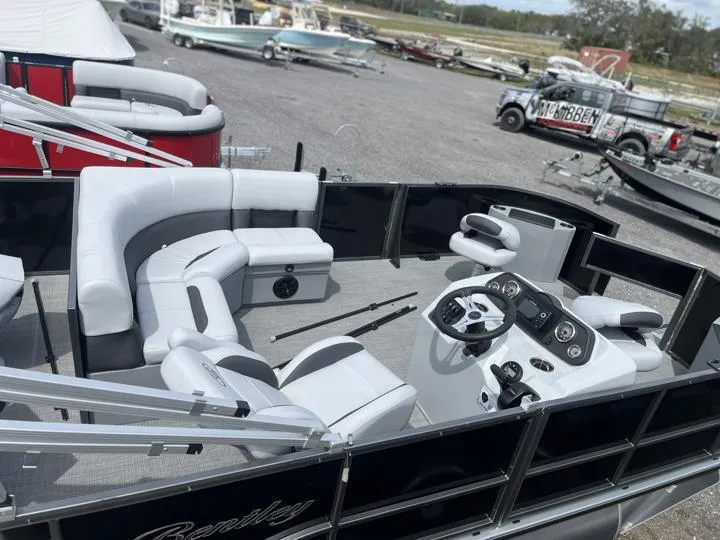 Slide: The Image of 2024 Bentley Pontoons LE 180 3 PT boat with luxurious seating and modern dashboard. - 7