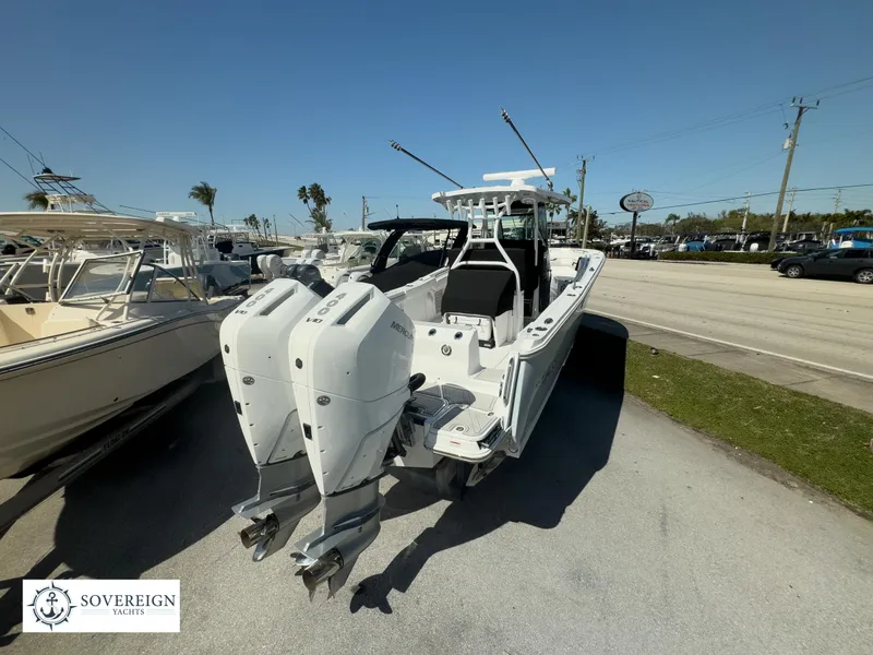 Slide: The Image of 2024 Blackfin 302CC boat with twin outboard engines on display. - 10