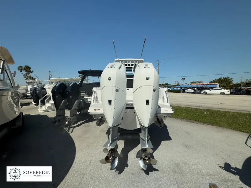 Slide: The Image of 2024 Blackfin 302CC boat with twin outboard engines at Sovereign Yachts. - 11