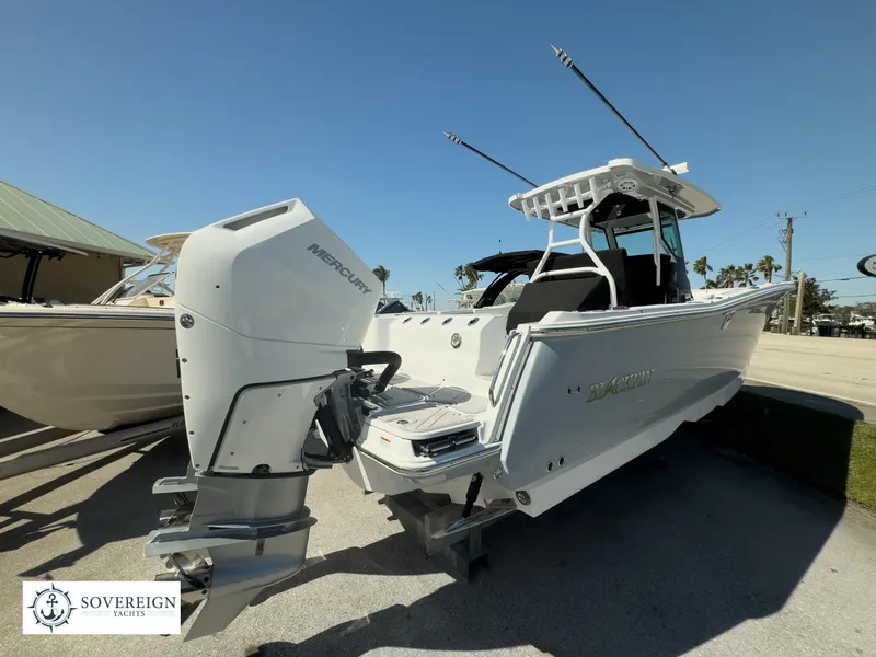 Slide: The Image of 2024 Blackfin 302CC boat with Mercury outboard engine displayed by Sovereign Yachts. - 12