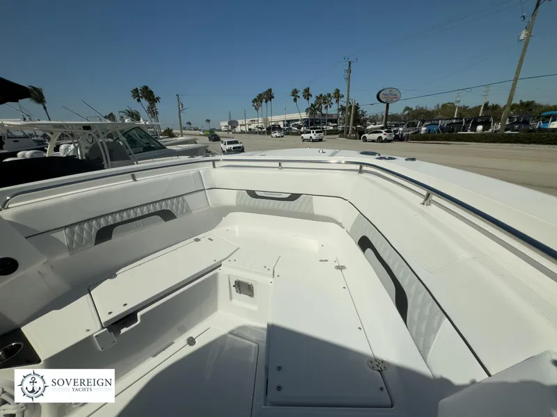 Slide: The Image of 2024 Blackfin 302CC boat interior with seating and storage compartments. - 18