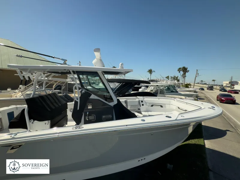 Slide: The Image of 2024 Blackfin 302CC boat displayed at Sovereign Yachts dealership. - 2