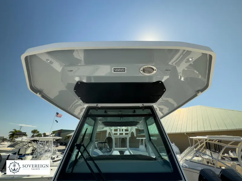 Slide: The Image of 2024 Blackfin 302CC boat at Sovereign Yachts dealership. - 21
