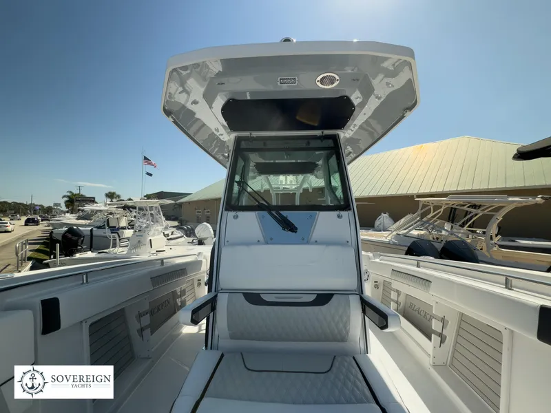 Slide: The Image of 2024 Blackfin 302CC center console boat at Sovereign Yachts dealership. - 23