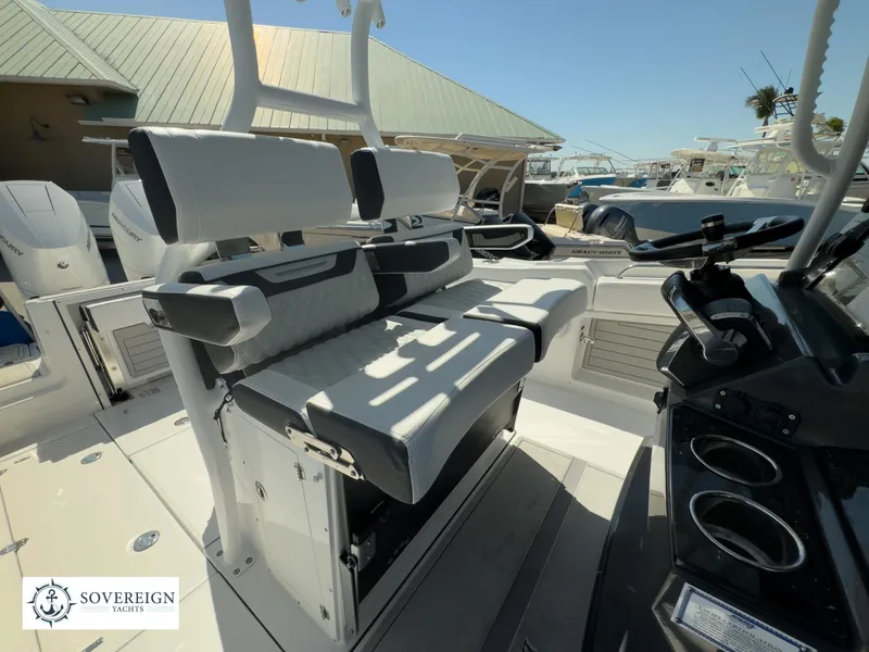 Slide: The Image of 2024 Blackfin 302CC boat interior with seating and control console, showcased by Sovereign Yachts. - 26