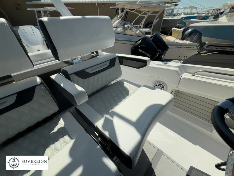 Slide: The Image of 2024 Blackfin 302CC boat interior with luxurious seating and Sovereign Yachts logo. - 30