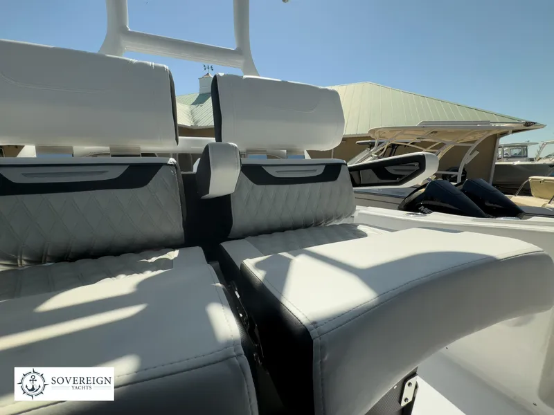 Slide: The Image of 2024 Blackfin 302CC boat interior seating with Sovereign Yachts logo. - 31