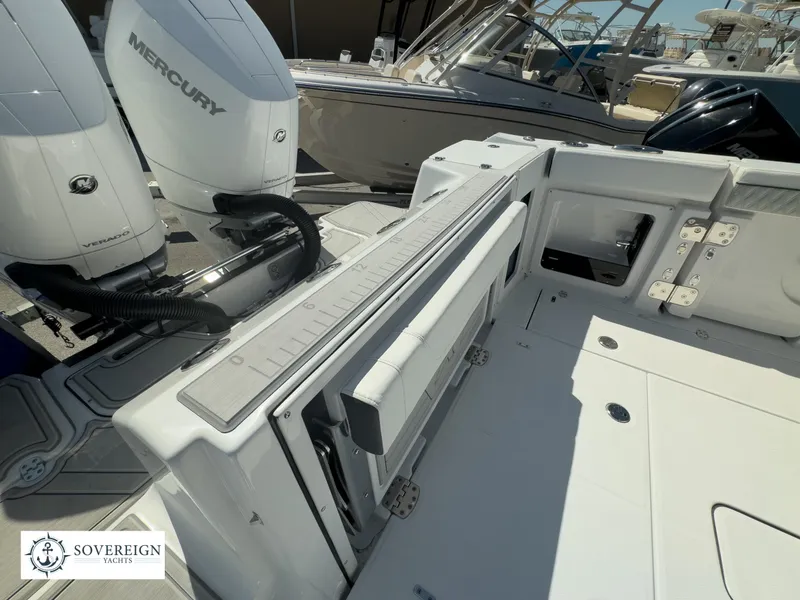 Slide: The Image of 2024 Blackfin 302CC boat deck with Mercury engines and Sovereign Yachts logo. - 35