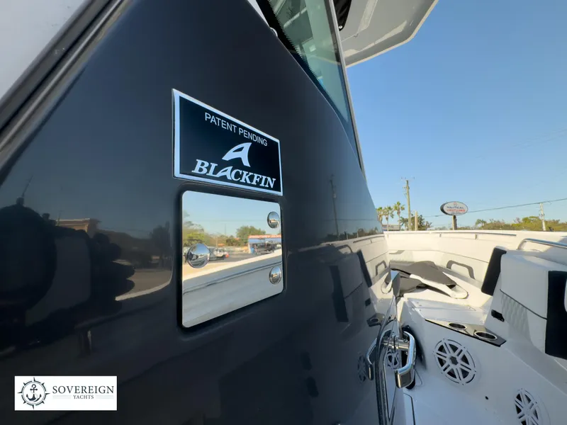 Slide: The Image of 2024 Blackfin 302CC boat exterior with logo and patent pending sign. - 39