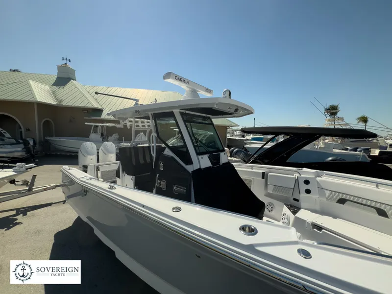 Slide: The Image of 2024 Blackfin 302CC boat at Sovereign Yachts dealership. - 4