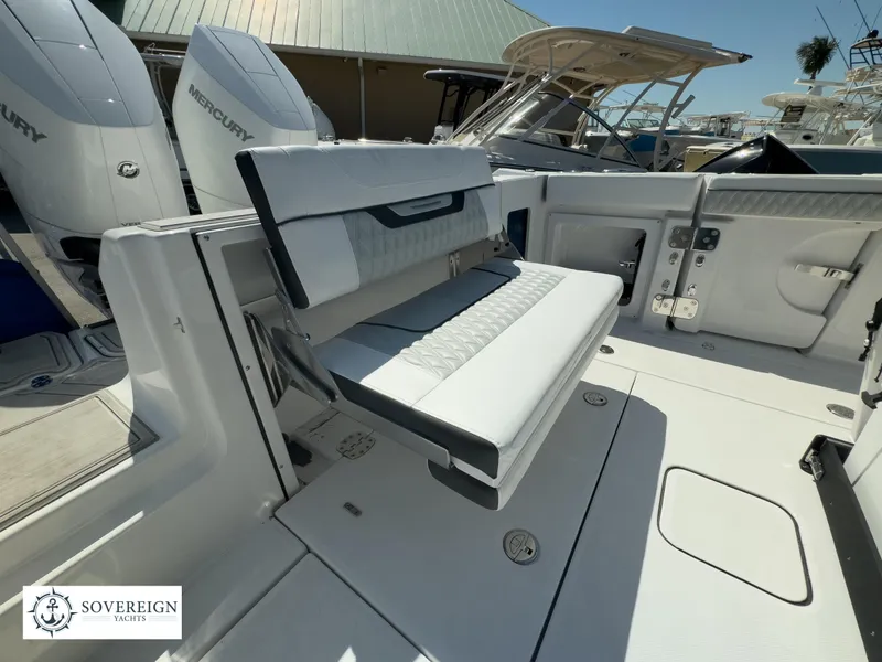 Slide: The Image of 2024 Blackfin 302CC boat interior with foldable seating and Mercury engines. - 40