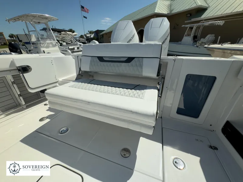 Slide: The Image of 2024 Blackfin 302CC boat with white seating and Sovereign Yachts logo. - 41
