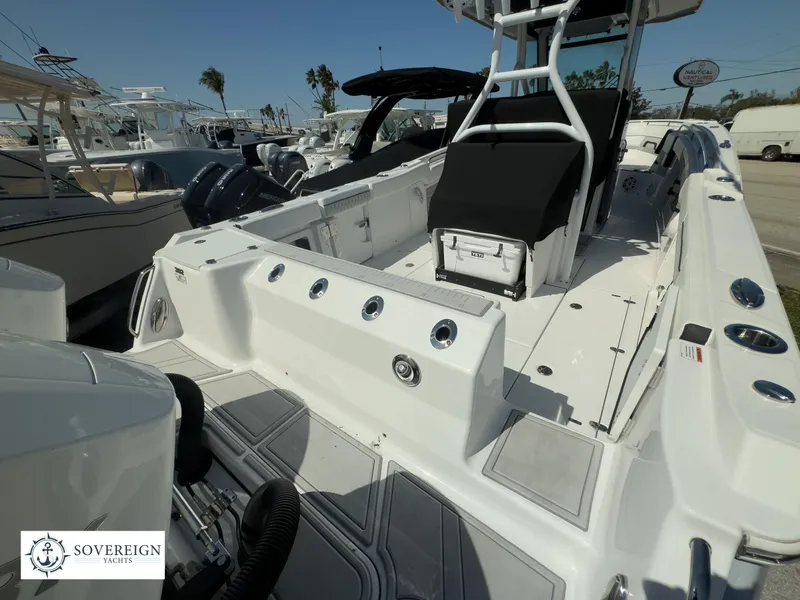 Slide: The Image of 2024 Blackfin 302CC center console boat at a marina, Sovereign Yachts logo visible. - 42