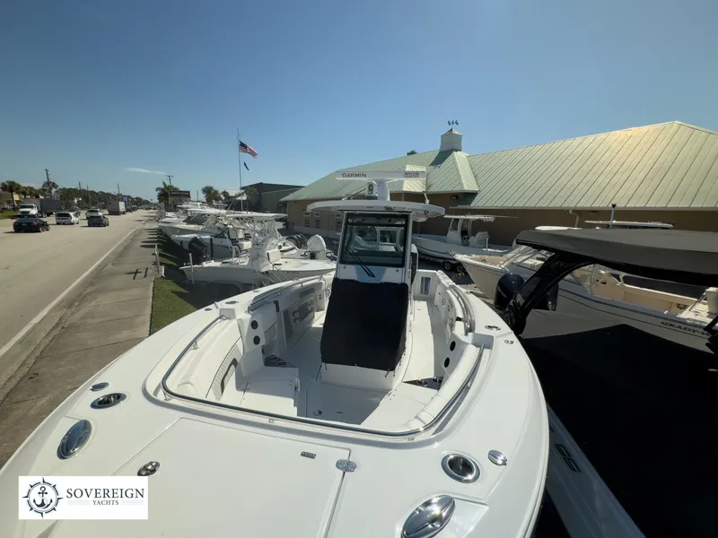 Slide: The Image of 2024 Blackfin 302CC boat displayed at Sovereign Yachts dealership. - 5