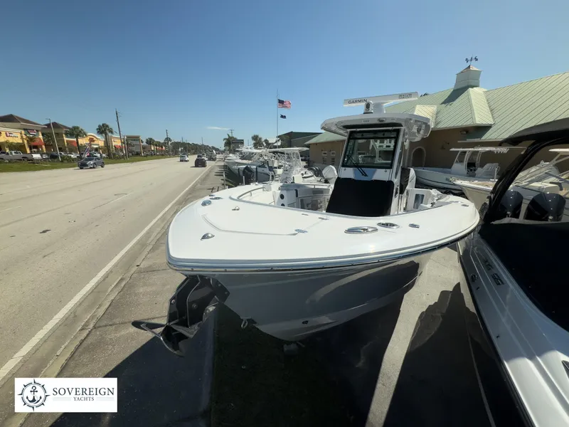 Slide: The Image of 2024 Blackfin 302CC boat displayed at Sovereign Yachts dealership. - 6