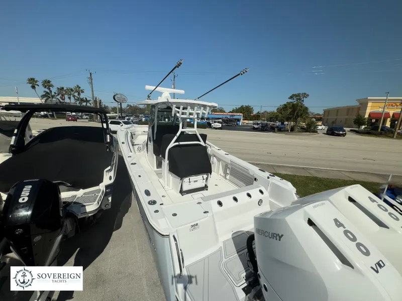 Slide: The Image of 2024 Blackfin 302CC boat with twin Mercury 400 engines at Sovereign Yachts. - 9