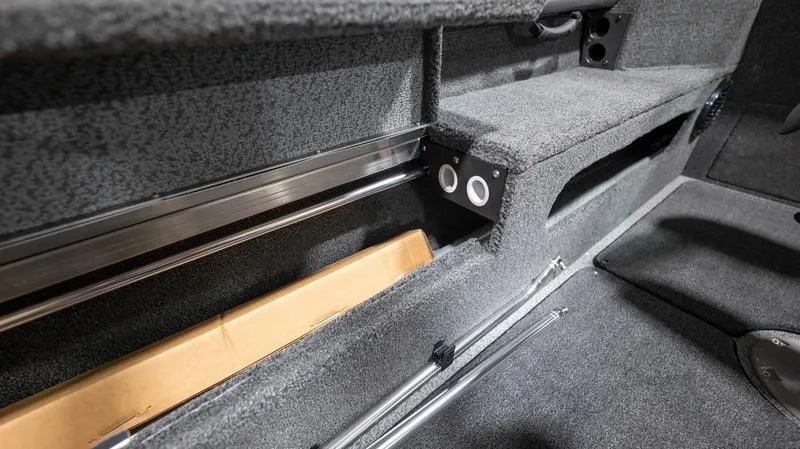 Slide: The Image of 2024 Lund 2025 Impact XS Sport interior storage compartment. - 20