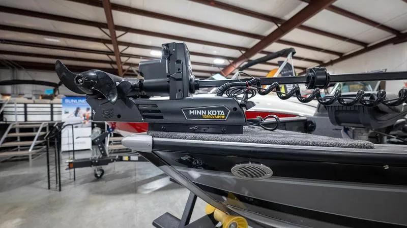Slide: The Image of 2024 Lund 2025 Impact XS Sport boat with Minn Kota trolling motor. - 4