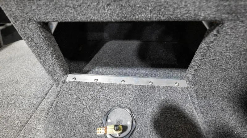Slide: The Image of 2024 Lund 2025 Impact XS Sport interior storage compartment. - 9