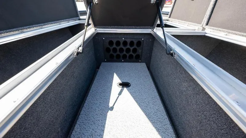 Slide: The Image of 2024 Lund 1875 Pro-V Bass XS storage compartment with rod holders. - 16
